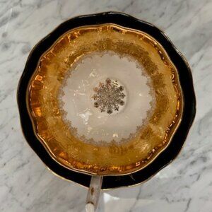 Rare and Stunning Heavy Gold Embossed Black Teacup and Saucer